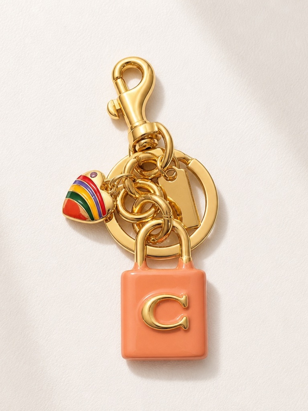 Coach Gold-Tone Keychain with Pink Charm & Multicolor Striped Heart